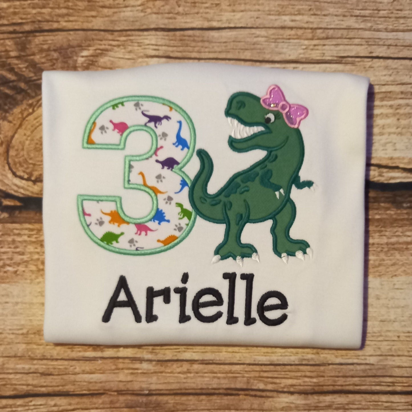 Childrens personalised birthday tshirt, Childs embroidered dinosaur shirt, kids dino top, t-rex with a bow tee, childrens clothes, gift
