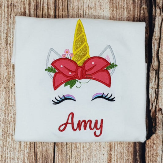 childrens personalised unicorn tshirt, unicorn wearing a bandana embroidered shirt