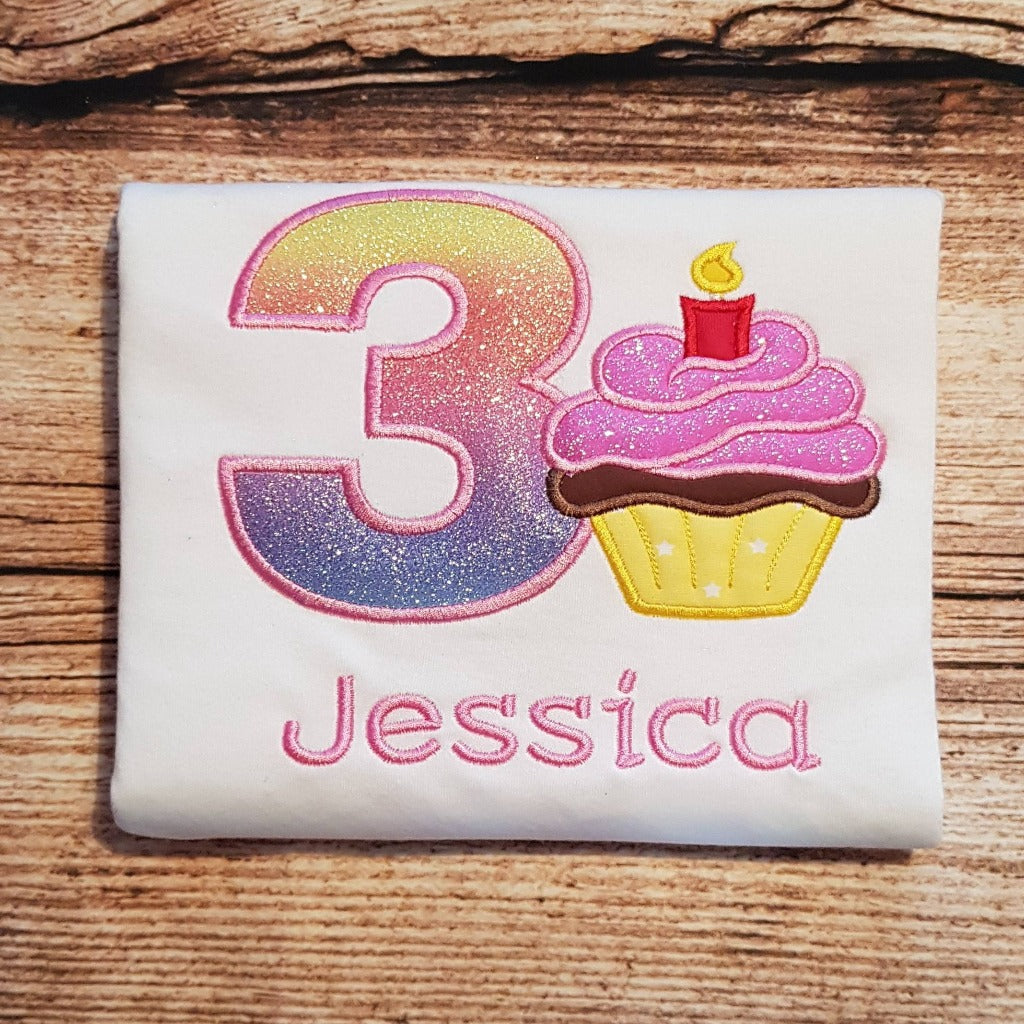 Childrens personalised birthday tshirt, childs embroidered cupcake with a candle birthday shirt