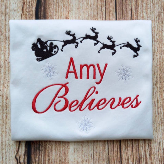 Childrens personalised Christmas tshirt, Childs xmas shirt, festive clothing, Believe in christmas embroidered top, gift for kids, santa tee