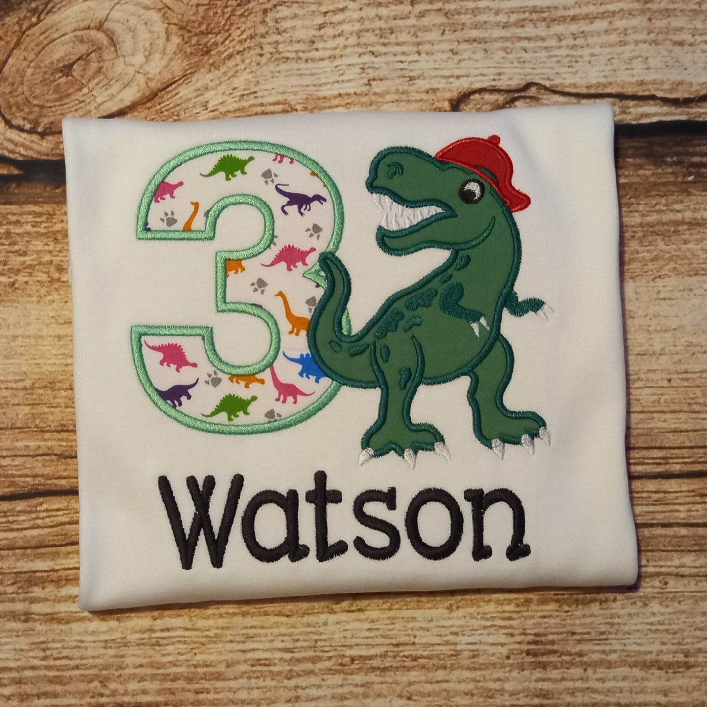 Childrens personalised birthday tshirt, Childs embroidered dinosaur shirt, kids dino top, t-rex in a baseball cap tee, childrens clothes