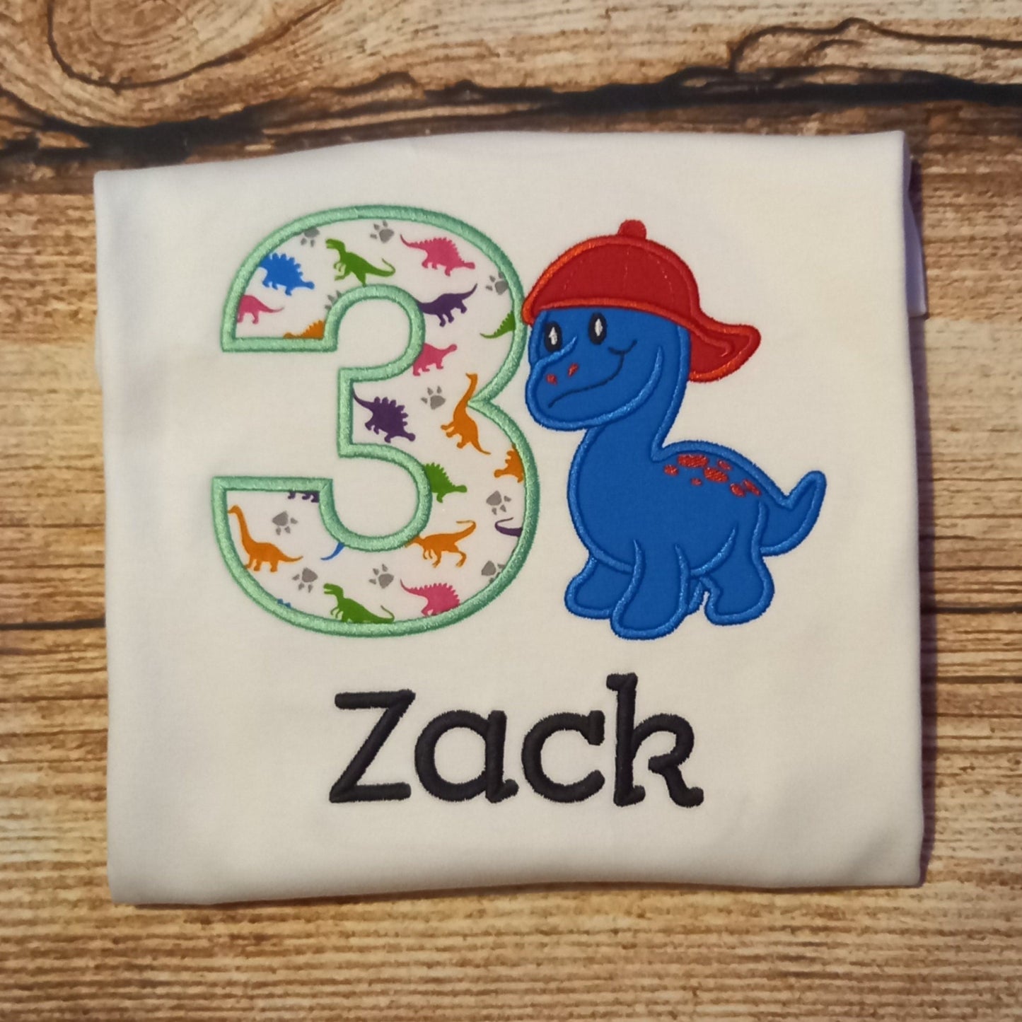 Childrens personalised birthday tshirt, Childs embroidered dinosaur shirt, kids dino top, dinosaur in a baseball cap tee, childrens clothes